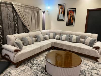 L shaped sofa in premium fabric with cushions