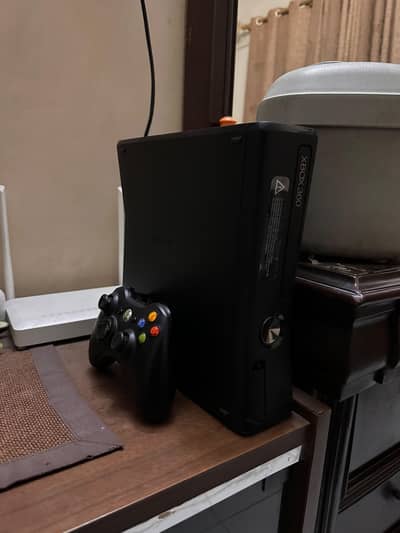 Xbox 360 with 78 games and controller in good condition