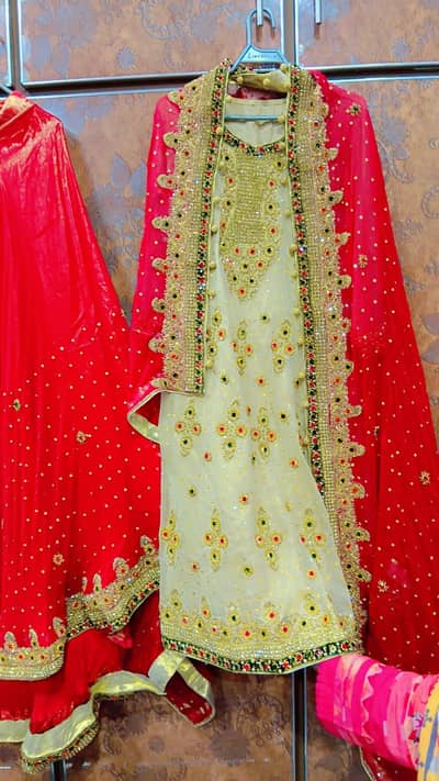 Beautiful red bridal lehenga with heavy golden embroidery