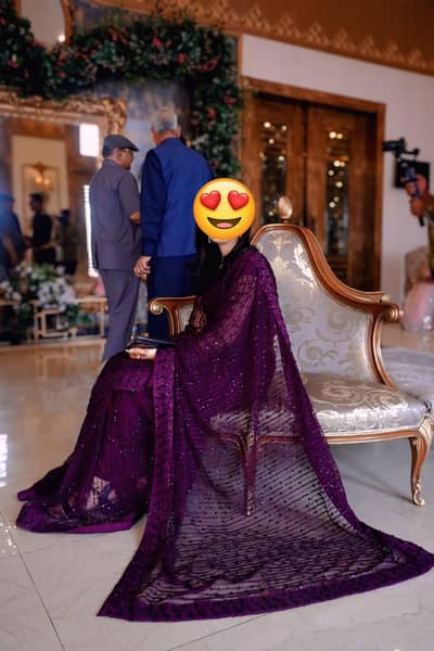 plum and black net saaree