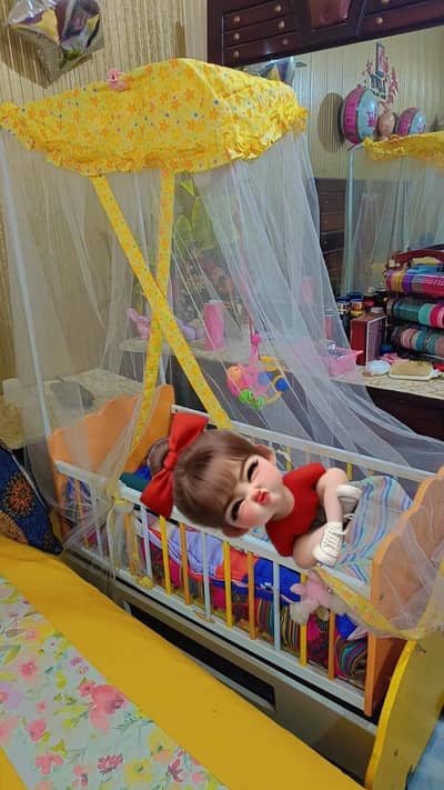 baby cot and swing