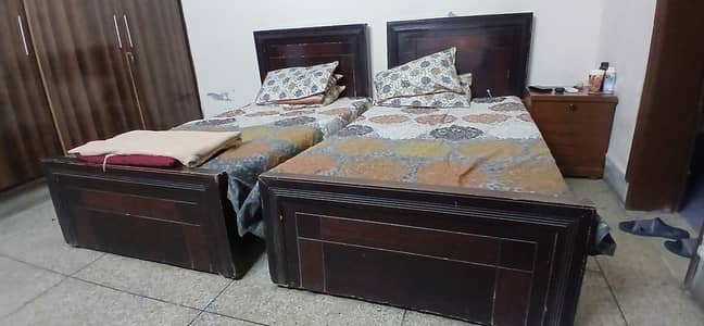 2 Single Wooden Beds with One Side Table