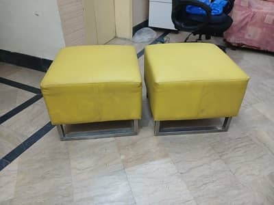 Cube-shaped metal-framed stool