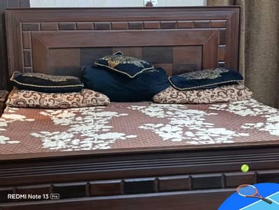 bed with two side tables and wall mirror set in new design