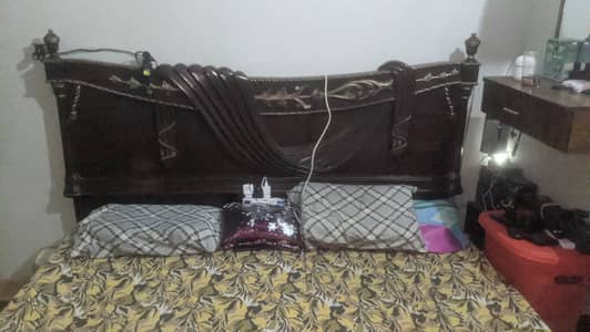 king bed polished with side tables and dressing table