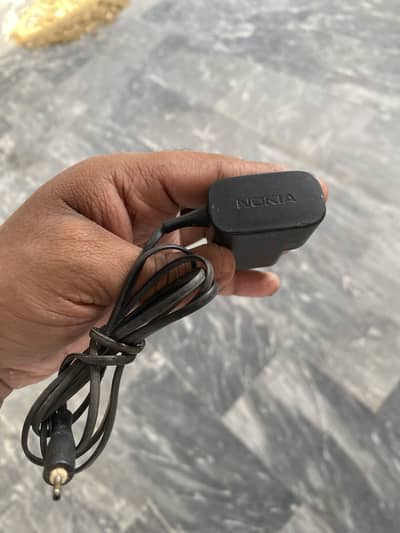 Nokia keypad phone pin type original charger. Available