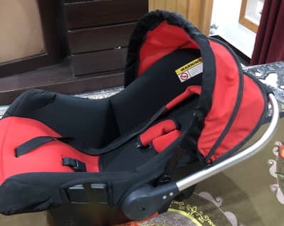 Black and red colour baby carry cot