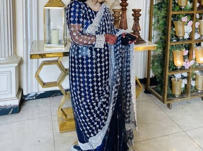 Luxury blue party wear dress with heavy silver cut dana work