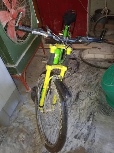 Green and yellow Trigon MTB 888 SP bicycle available for sale.