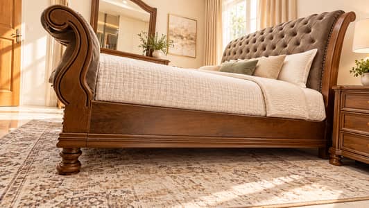 Elegant wooden bedroom set comprising a bed with upholstered headboard