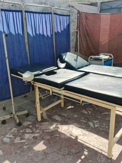 Delivery bed, clinical instruments, side table,single bed