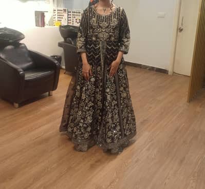 Beautiful Black maxi with silver a d gold embellishments for 17000 RS.