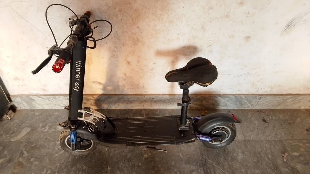 electric scooty range 4
