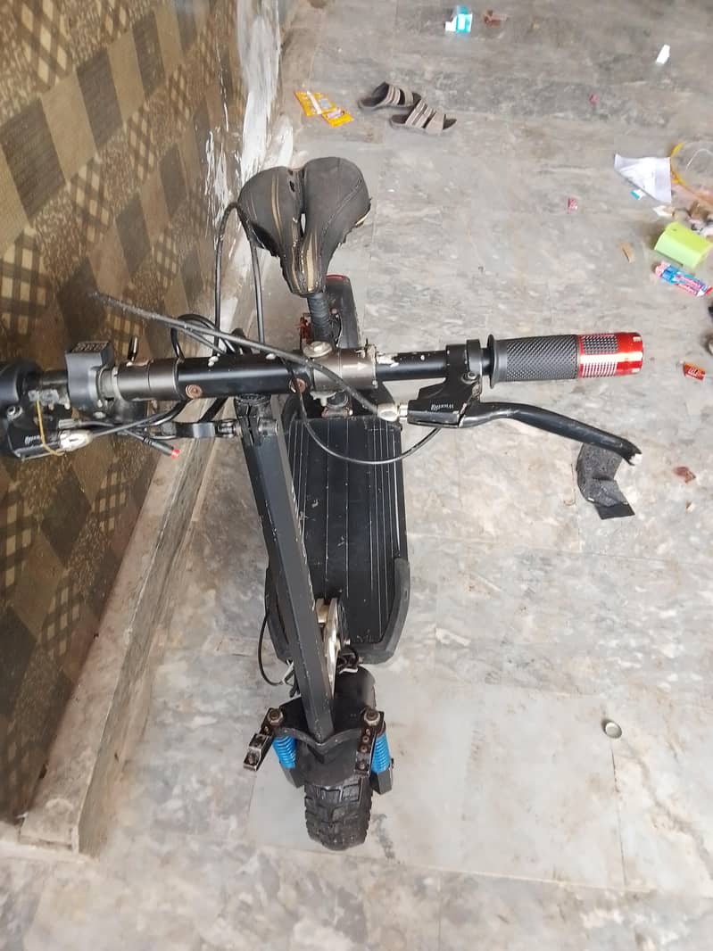 electric scooty range 10