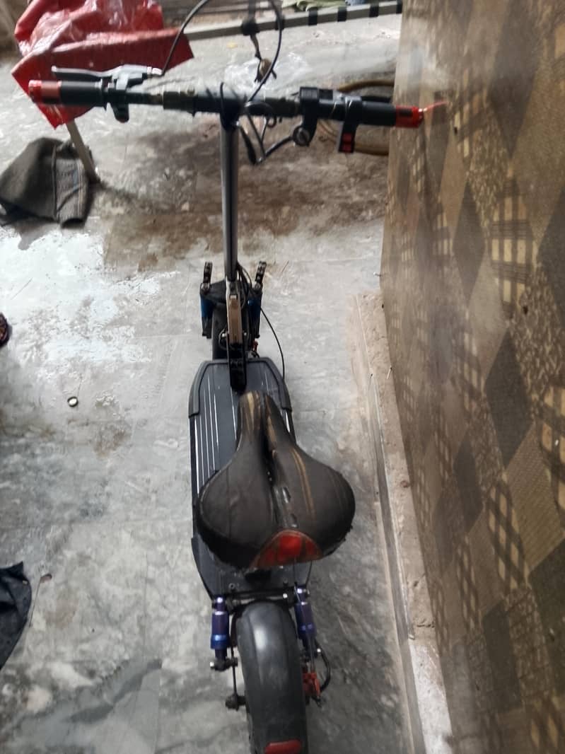 electric scooty range 11