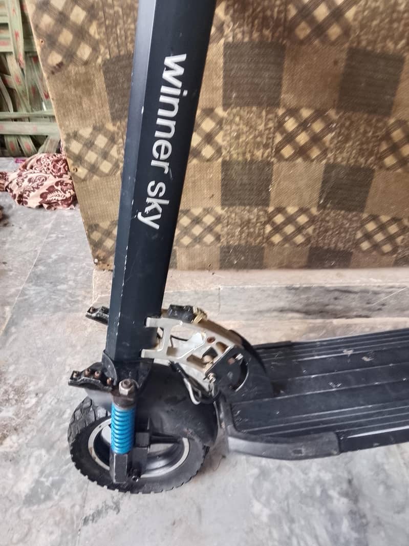 electric scooty range 12