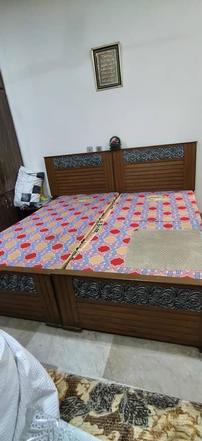 2 wooden beds with  quality matress