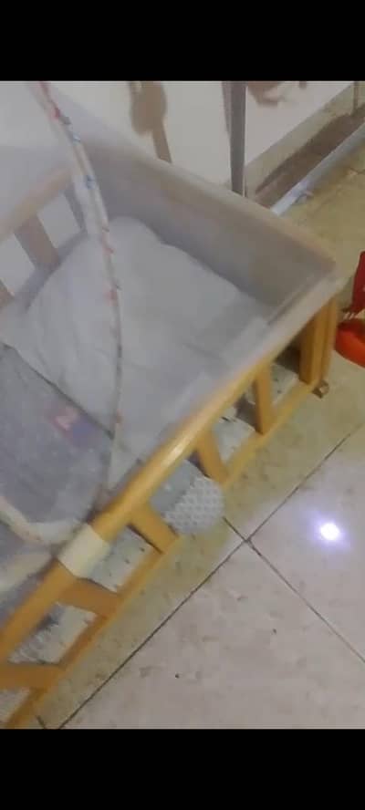 wooden crib with mosquito net and included swing