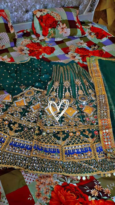 Beautiful dark green bridel party wear lengha with heavy  golden embor