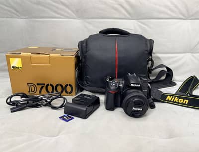 Nikon D7000 DSLR with 35 mm f/1.8G prime lens (very low shuttercount)