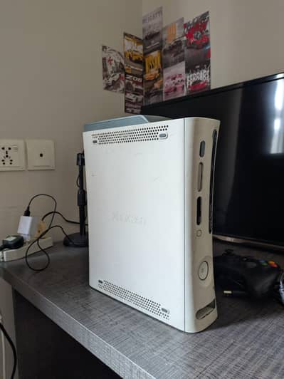 Xbox 360 fat for sale with a new wired controller