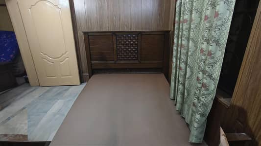 double size king size bed with two side tables