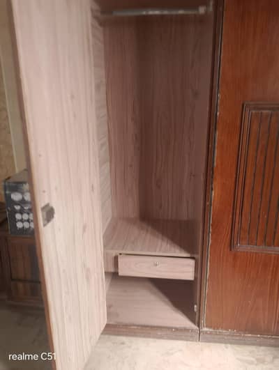 bed and wardrobe and side table
