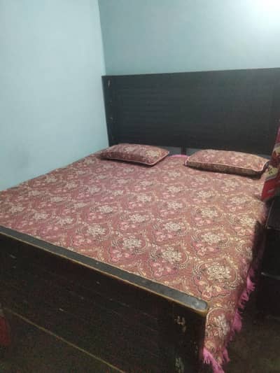 Double wooden bed for Sale