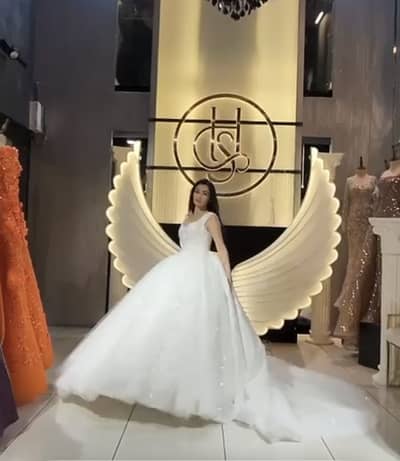 beautiful white Turkish-style bridal gown with heavy silver/beaded