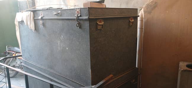 Two large pure iron trunk peti with stands + two small trunk
