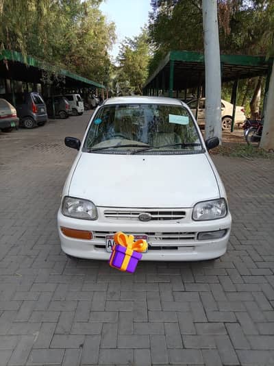 Daihatsu Cuore 2006(Faisal colony Okara)All decoment orignal