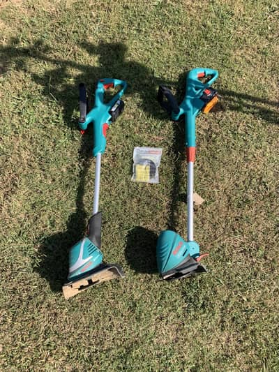 2 Bosch electric grass cutters (READ DISCRIPTION)