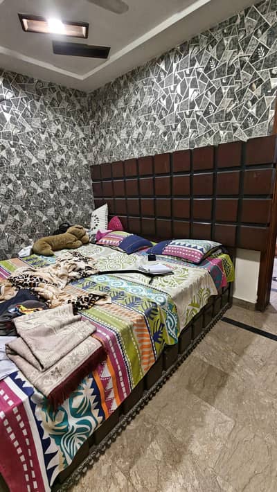 king bed with dressing and side table