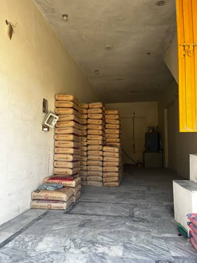 shop for sale Basement with ground and first floors. First floor features one bedroom with attached bathroom, TV lounge, kitchen, and all basic utilities, including water and electricity.