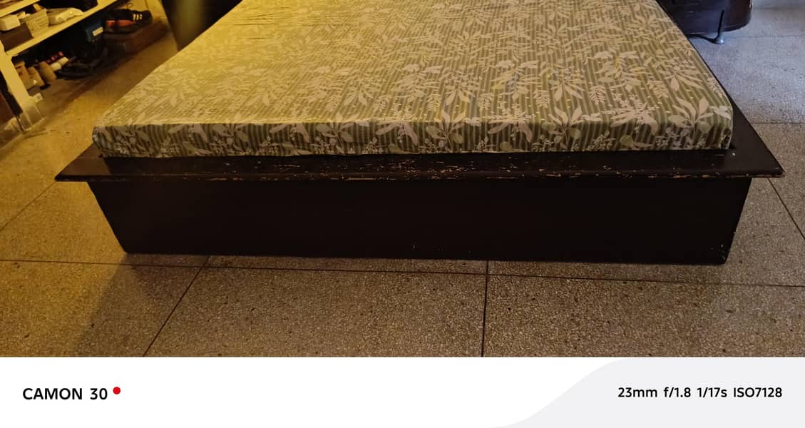 king size bed with one side table 1