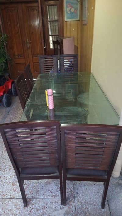 Urgent for sale wooden Six seater glass top in good condition