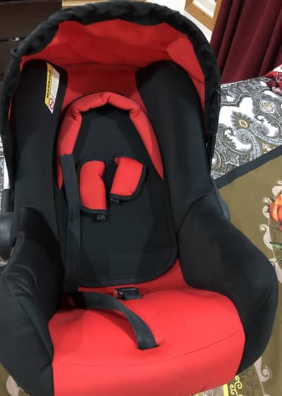 Black and red colour baby carry cot 10/10condition