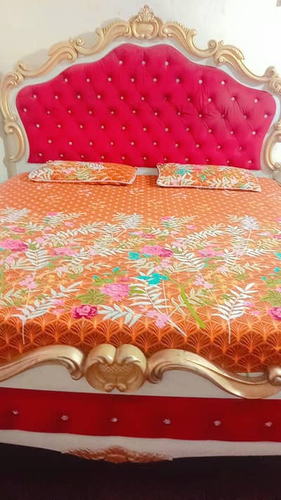 Double bed with two  side table and cupboard