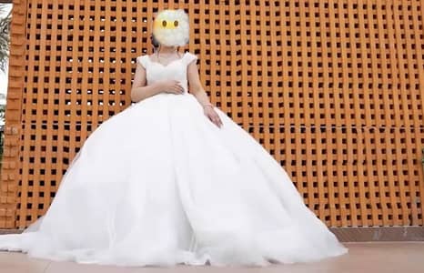 beautiful white Turkish-style bridal gown with heavy silver/beaded