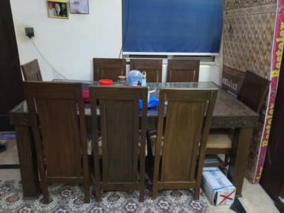 8 seater dining table for sale made up of wood excellent condition