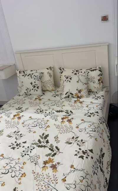 White wooden bed with molty foam mattress