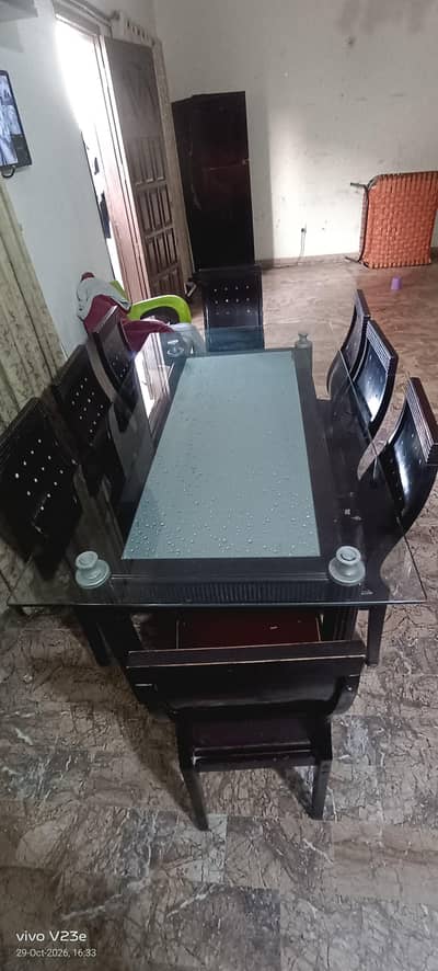 Double Glass Wooden Dinning Table with 8 wooden chairs for sale.
