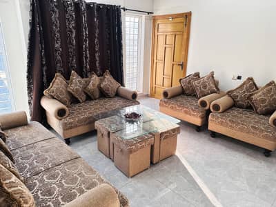 Elegant 7-Seater Fabric Sofa Set with Glass Table & Ottomans