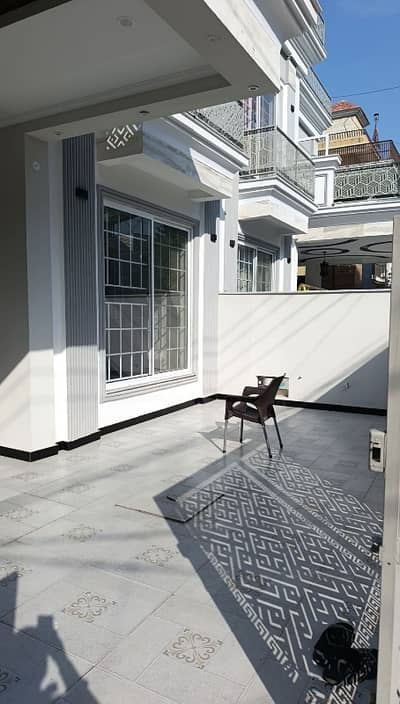 A BEAUTIFUL 8 BEDROOMS DESIGNER 10 ( MARLA OLD) BRAND NEW HOUSE