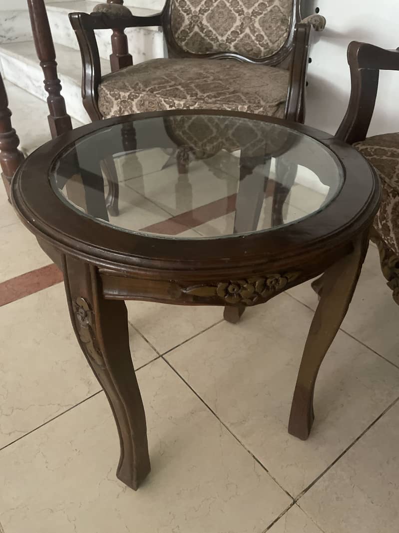 Two chairs with a coffee table 1