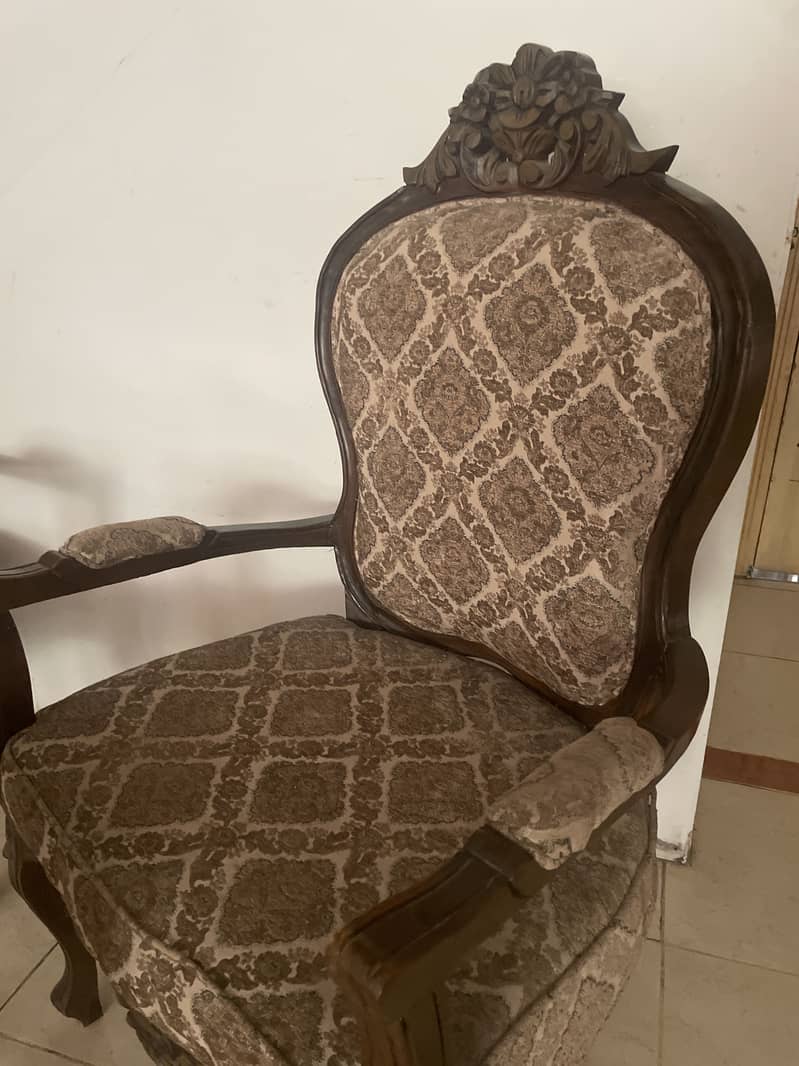Two chairs with a coffee table 2