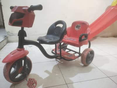 Red tricycle for kids with back support