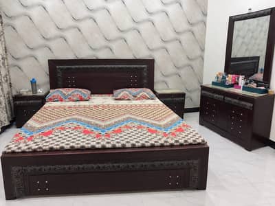 double bed with side table and dressing