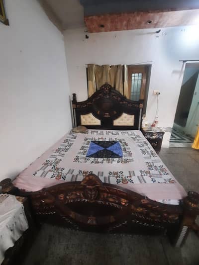 full size bed and dressing table. .