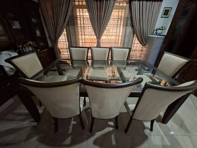 Solid Dinning Table (Glass Top) with 8 seats. Almost New (Show Room)